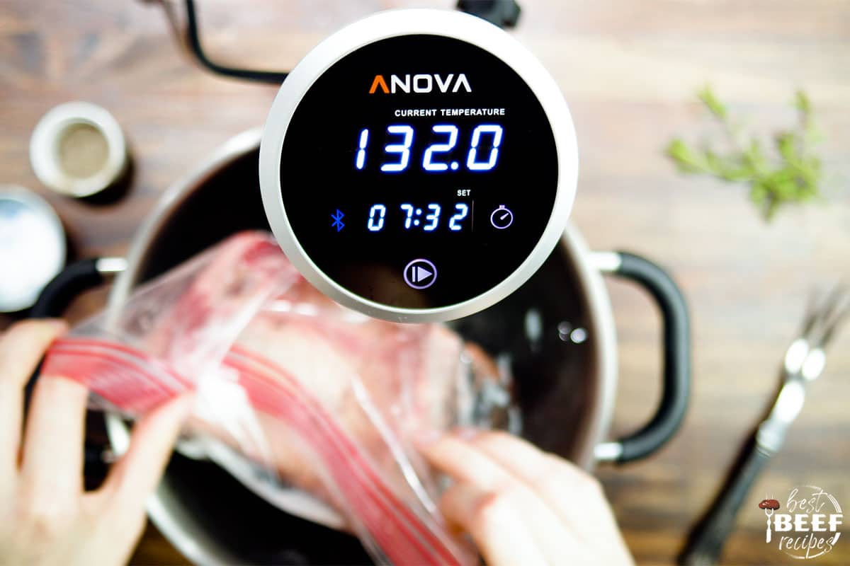 Sous vide cooker showing temperature of water for prime rib