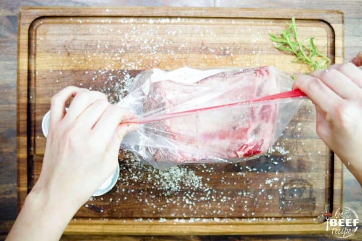 Sealing bag with prime rib in it