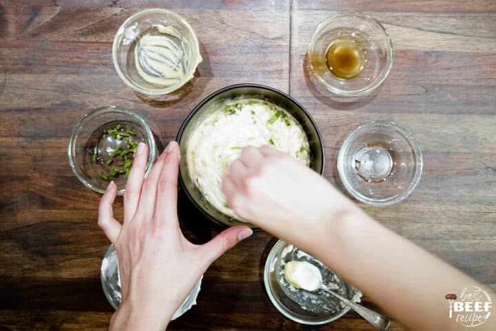 Mixing horseradish suace ingredients in a bowl