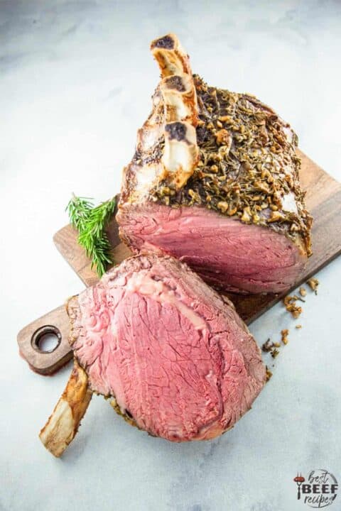 Standing rib roast sliced on a serving board