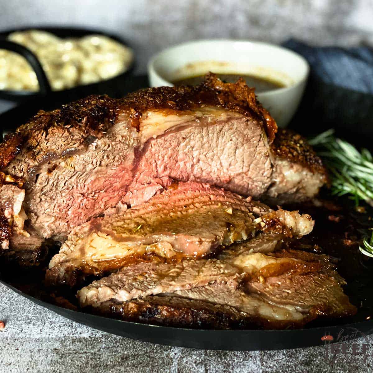 Air fryer prime rib sliced on a black plate