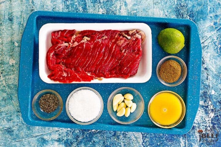 carne asada taco ingredients on a blue platter