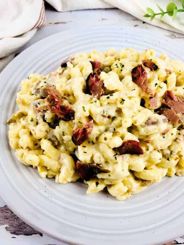 brisket mac and cheese on a white plate