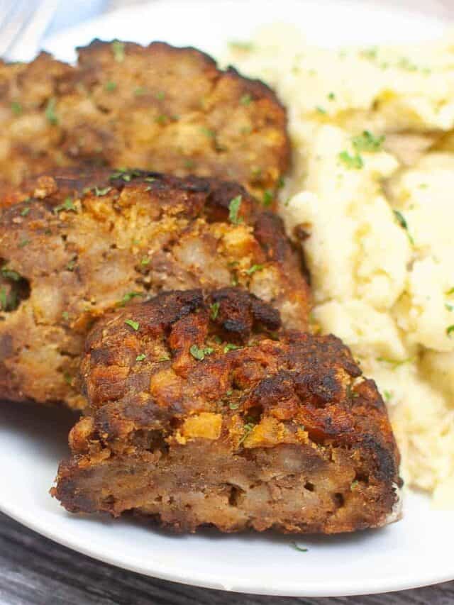 three slices of meatloaf with mashed potatoes