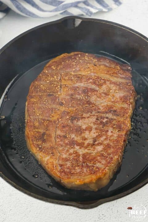 cooking wagyu steak in a skillet