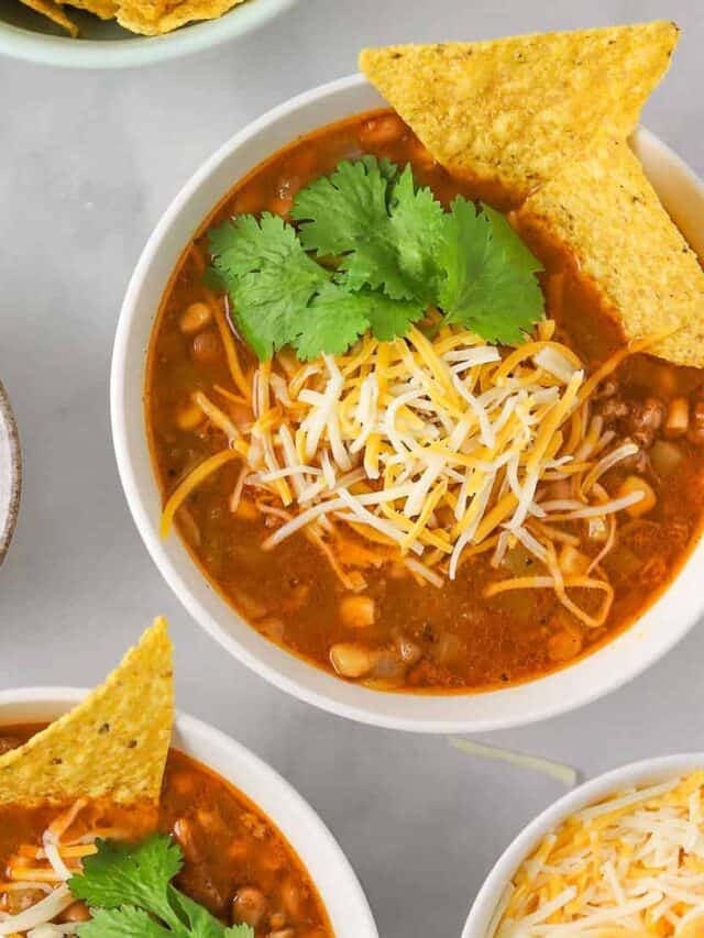 two bowls of taco soup with tortilla chips