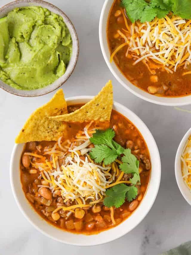 two bowls of taco soup with tortilla chips