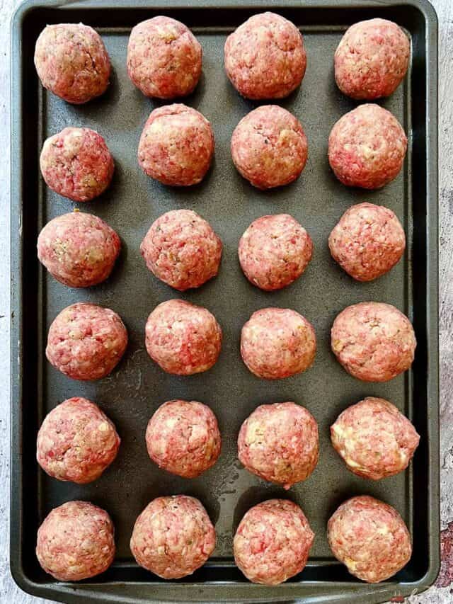 meatballs rolled on a tray