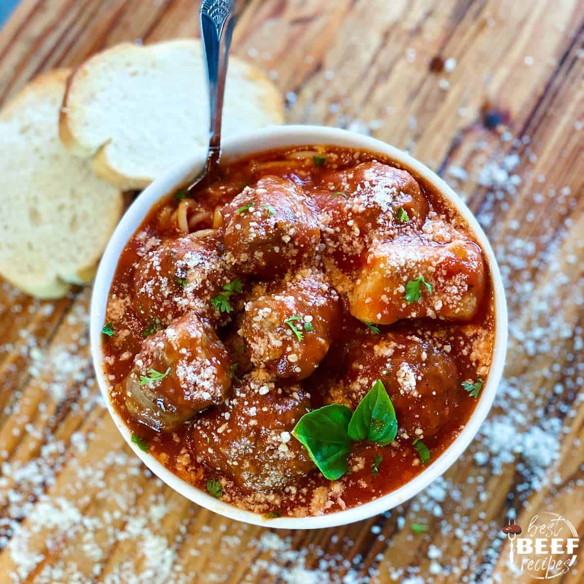 meatball spaghetti suace in a bowl with a fork