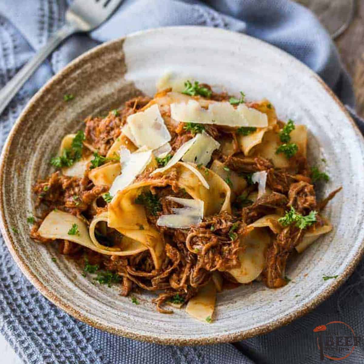 slow cooker beef ragu in a grey bowl