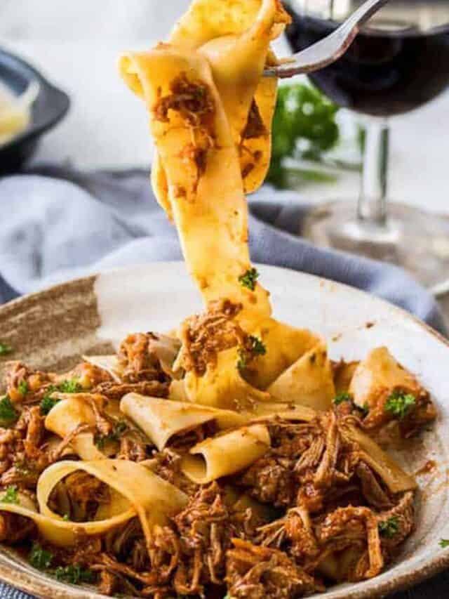 beef ragu in a gray bowl with a fork