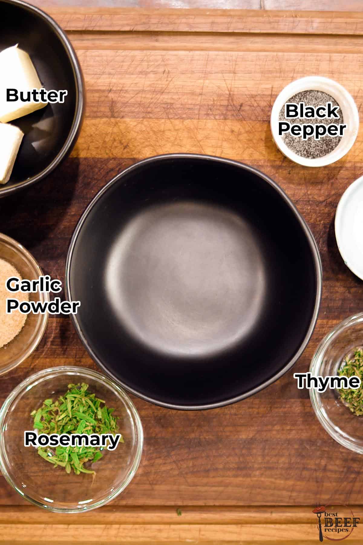 Butter rub ingredients in separate bowls with labels, next to an empty mixing bowl