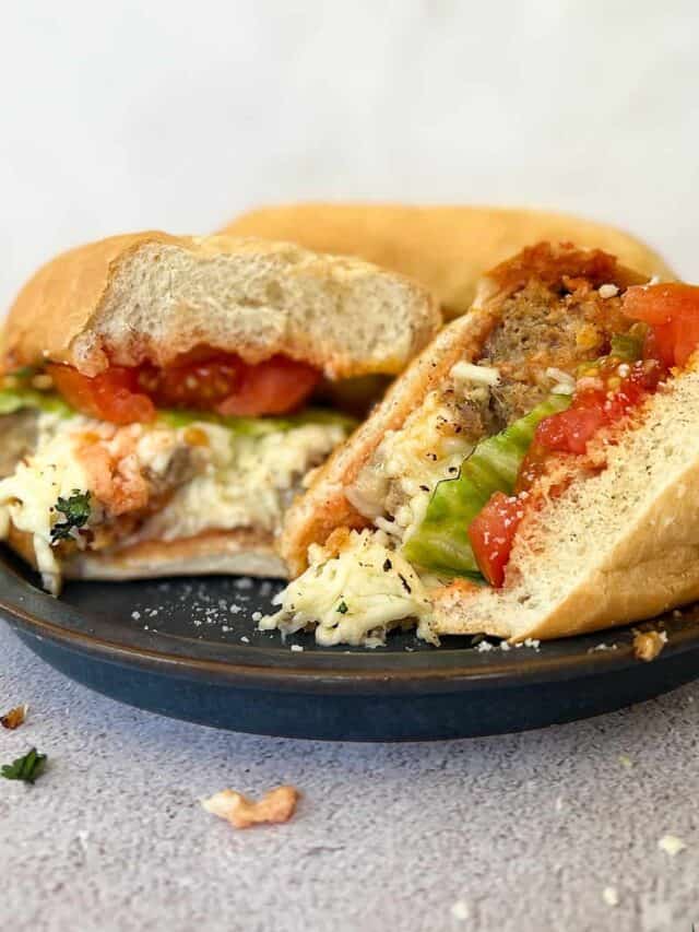 meatloaf sandwich cut in half on a blue plate