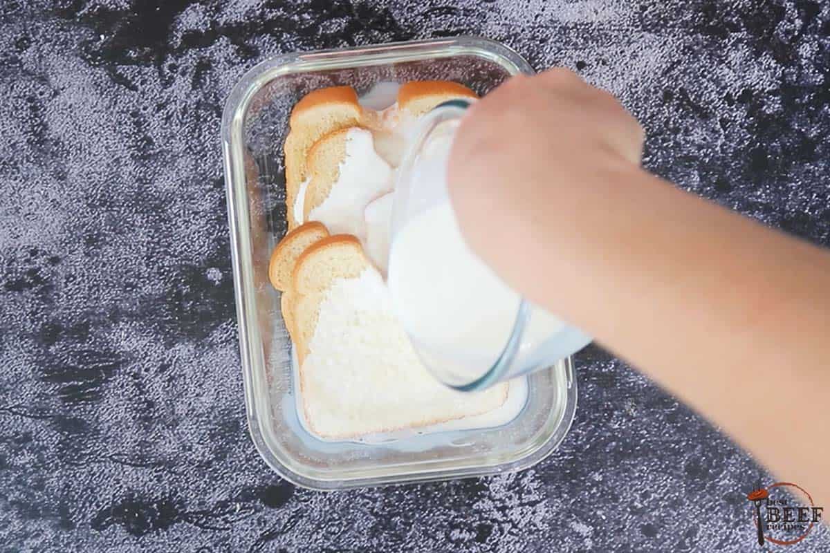 pouring milk into container with bread