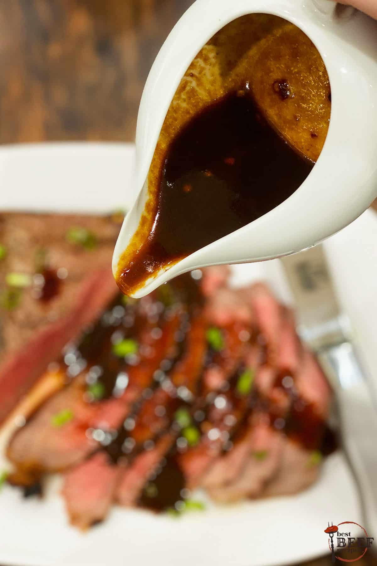 London broil marinade sauce in a white dish ready to pour over steak