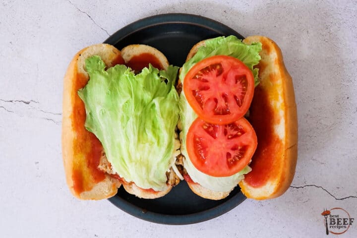 lettuce and tomato on a meatloaf sandwich