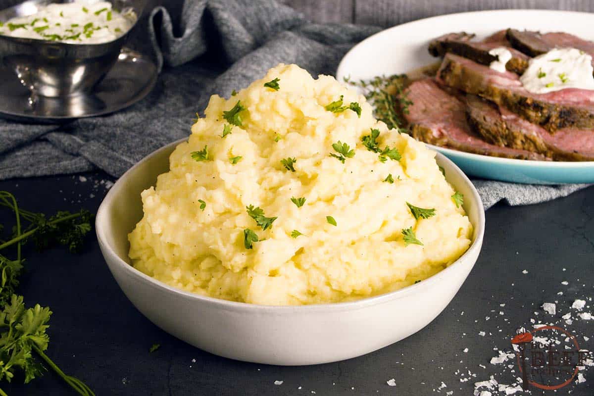 mashed potatoes for steak in a white bowl