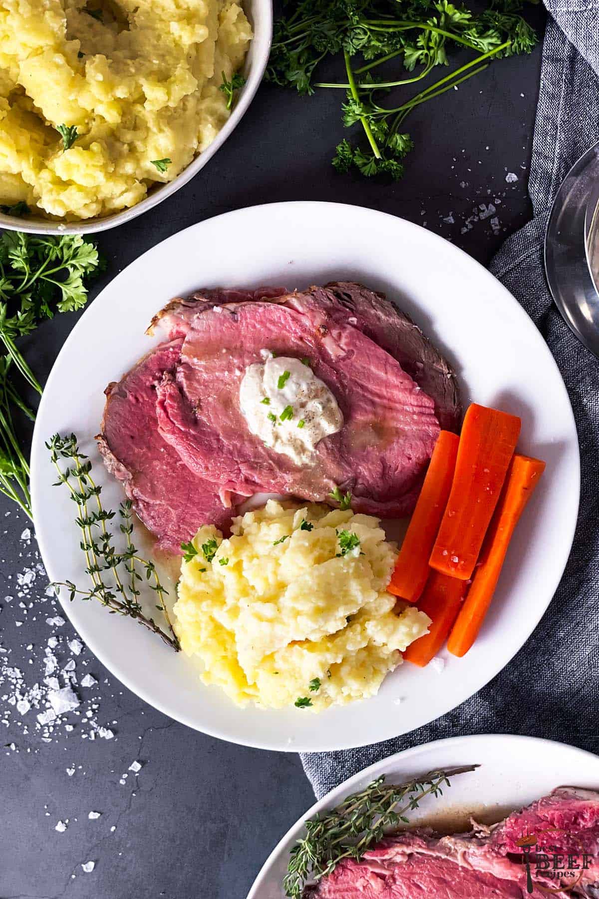 mashed potatoes for steak on a plate with beef and carrots