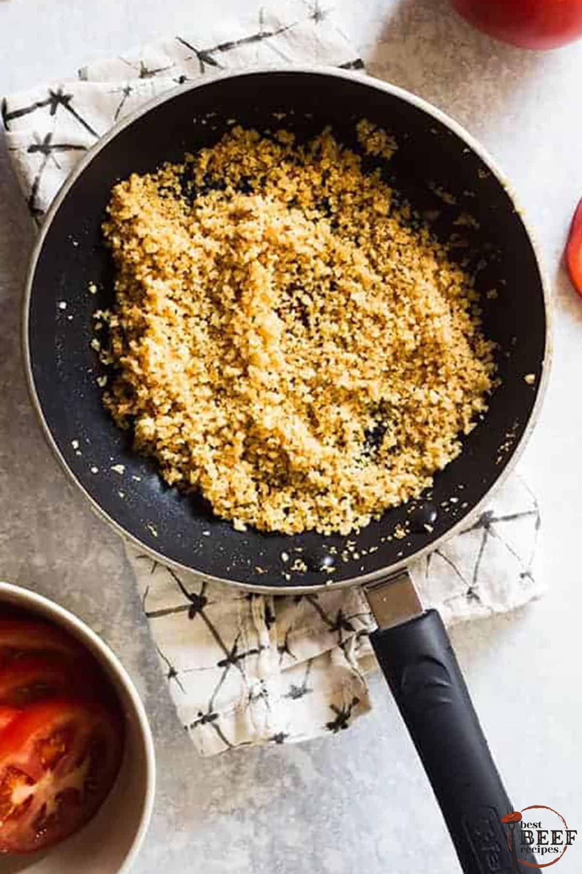 butter and breadcrumbs browning in a saucepan for steakhouse mac and cheese