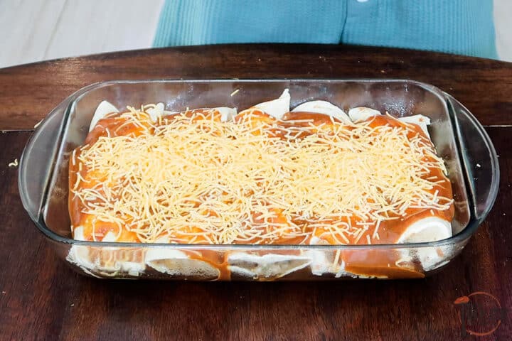 rolled enchiladas ready to be baked