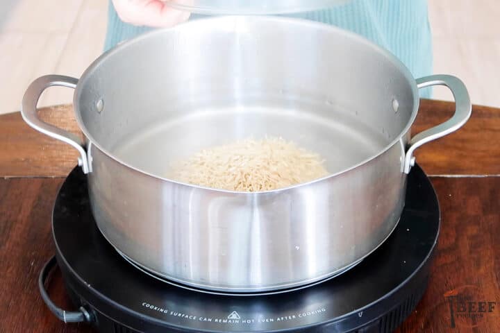 rice in a pot of boiling water
