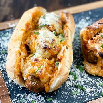 meatball subs on a cutting board up close