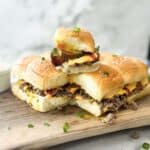 cheeseburger sliders on a wooden serving board