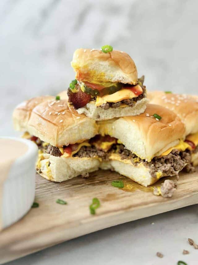 bacon cheeseburger sliders stacked together