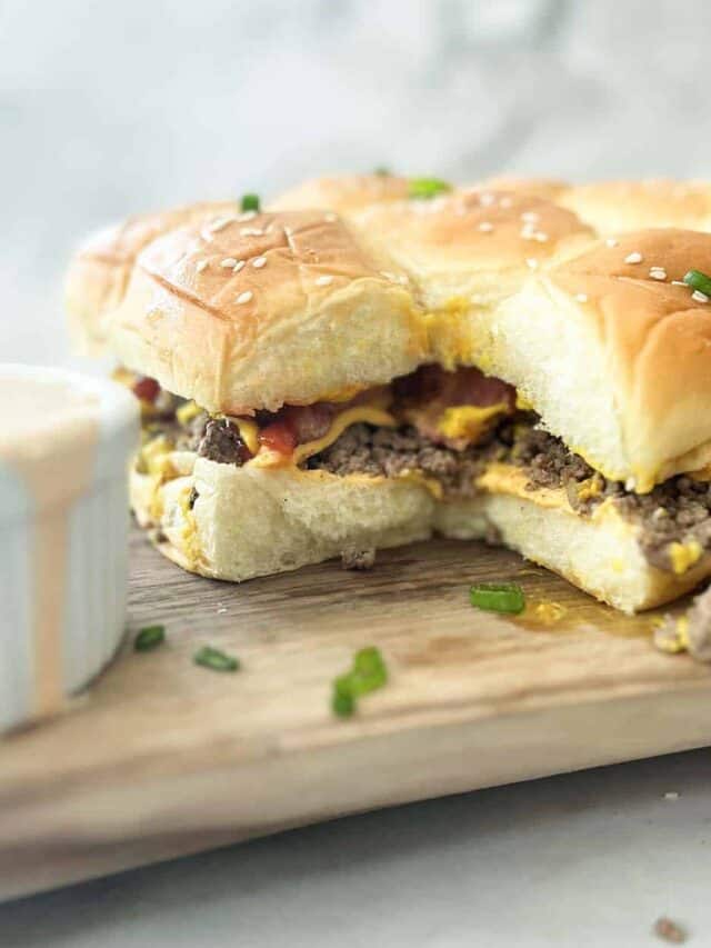 cheeseburger sliders with bacon on a serving board