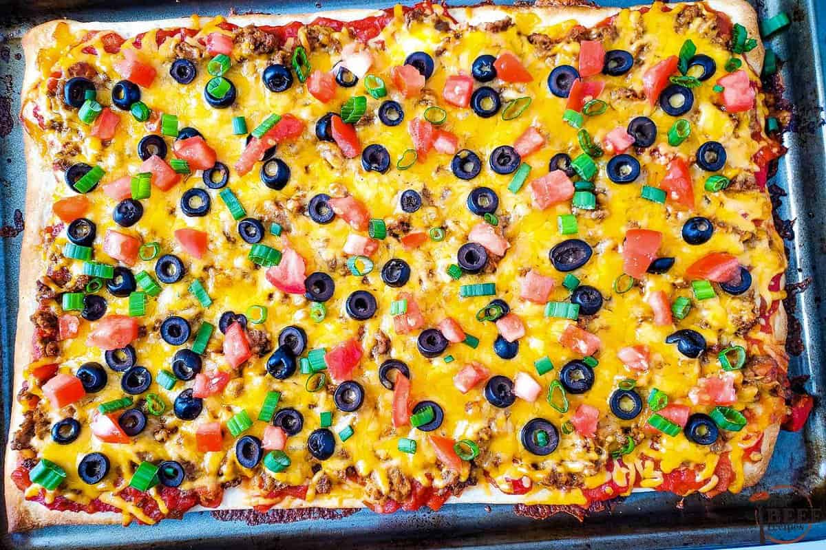 the completed taco pizza with toppings