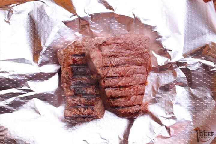 grilled sirloin steak on a sheet of foil