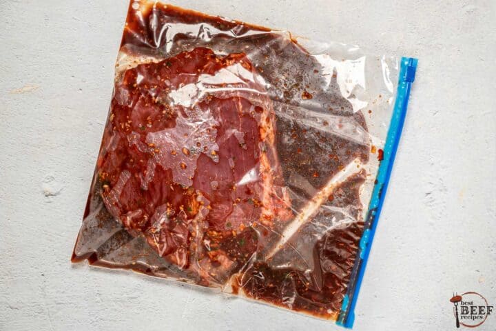 steak marinating in a plastic bag