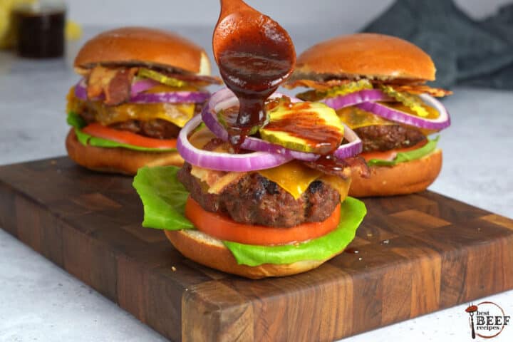 topping a burger with bbq sauce