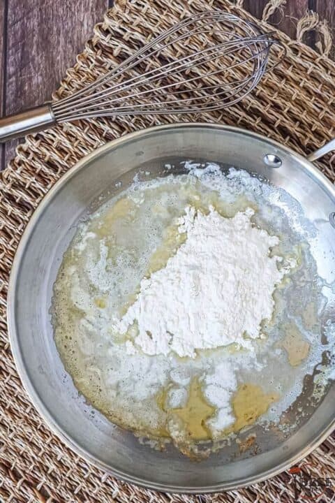 butter and flour in a pan to make a roux