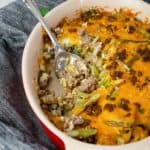 hamburger casserole in a casserole dish with a serving spoon