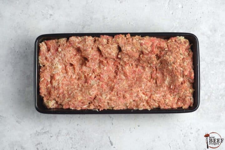 beef mixture inside of loaf pan