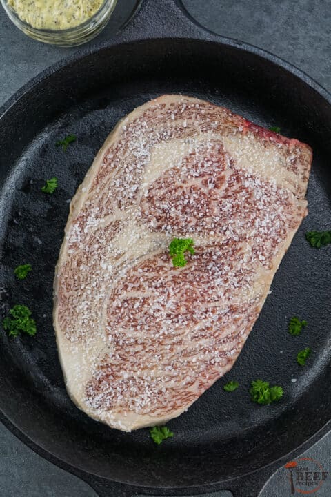 wagyu steak cooking in a pan