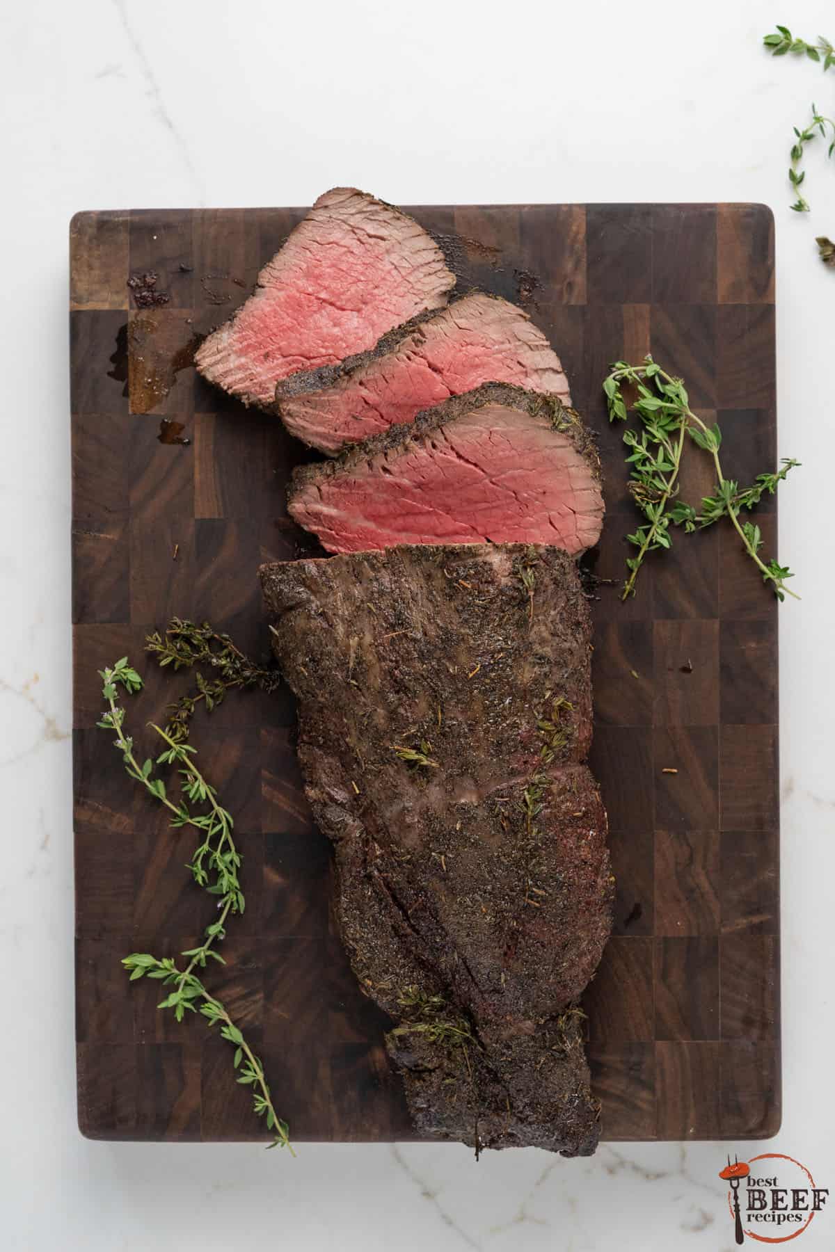 beef tenderloin on a wood cutting board