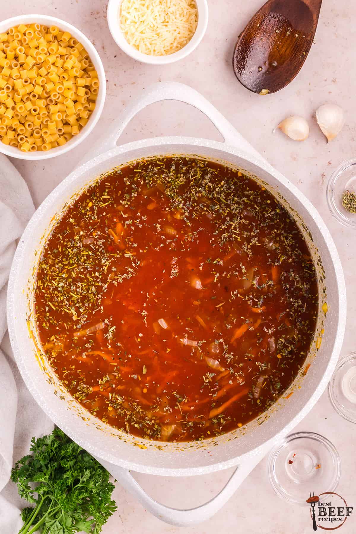 adding seasoning to soup base in a pot