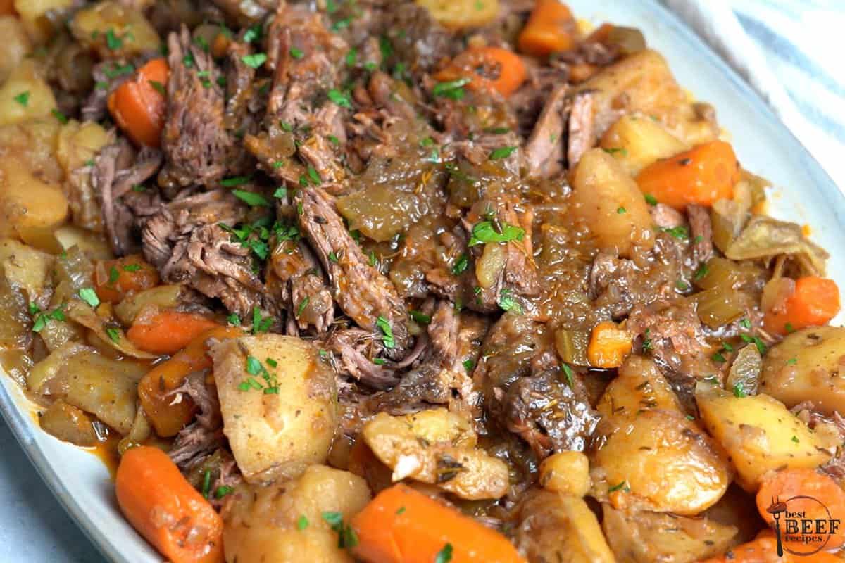 potatoes and carrots on a platter with slow cooker roast beef