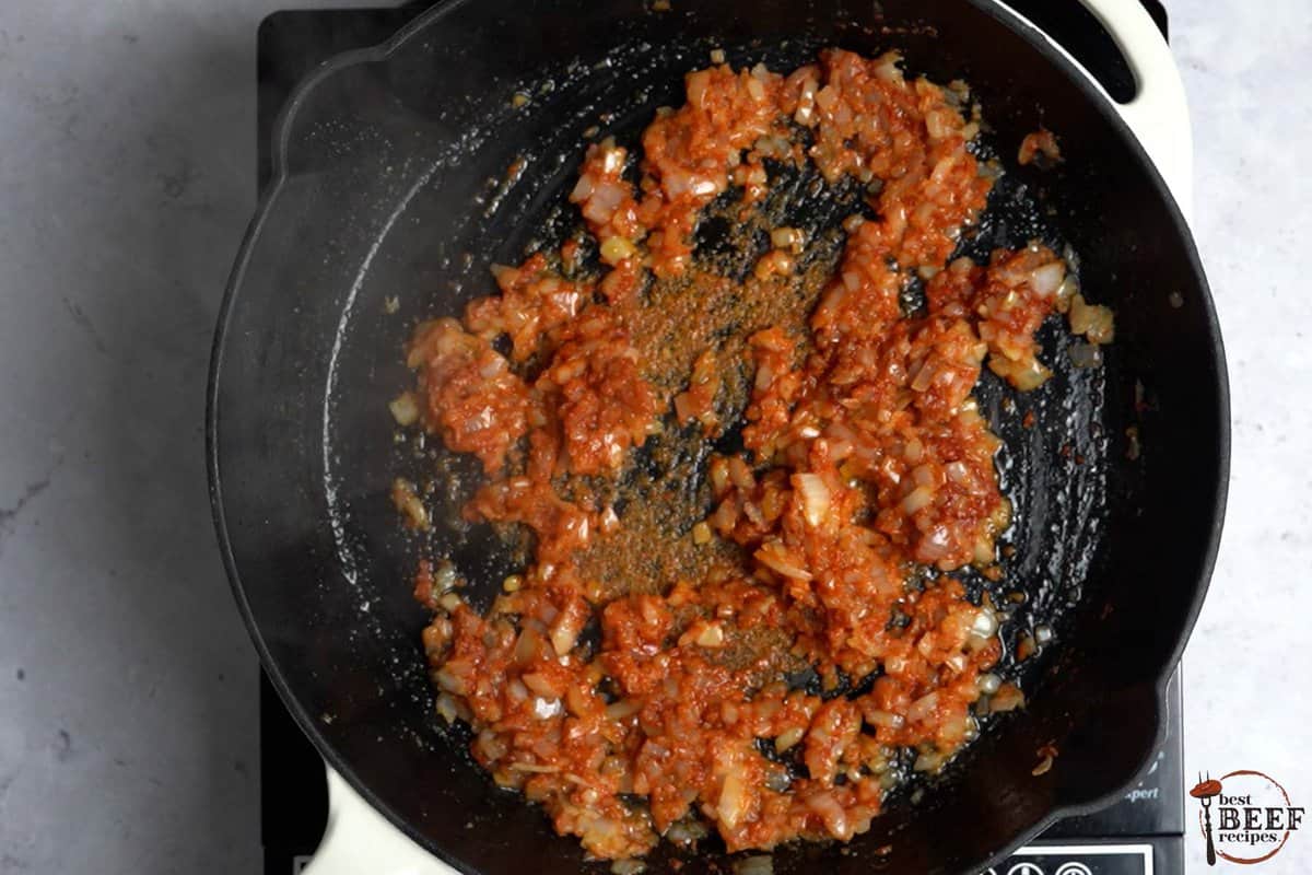 tomato and onion mixture in skillet