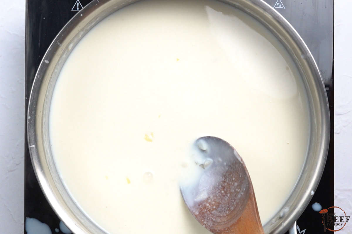 milk added to the roux and garlic