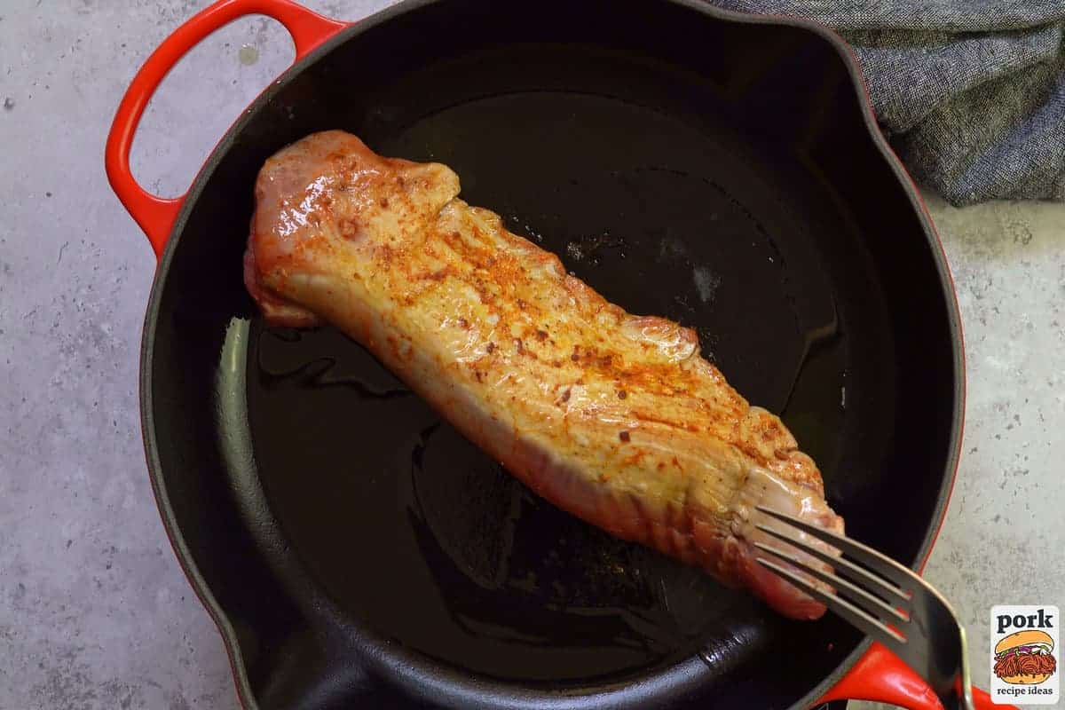 searing pork tenderloin in a pan