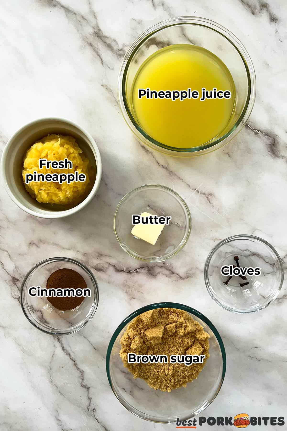 all the ingredients for pineapple ham glaze in separate bowls with labels