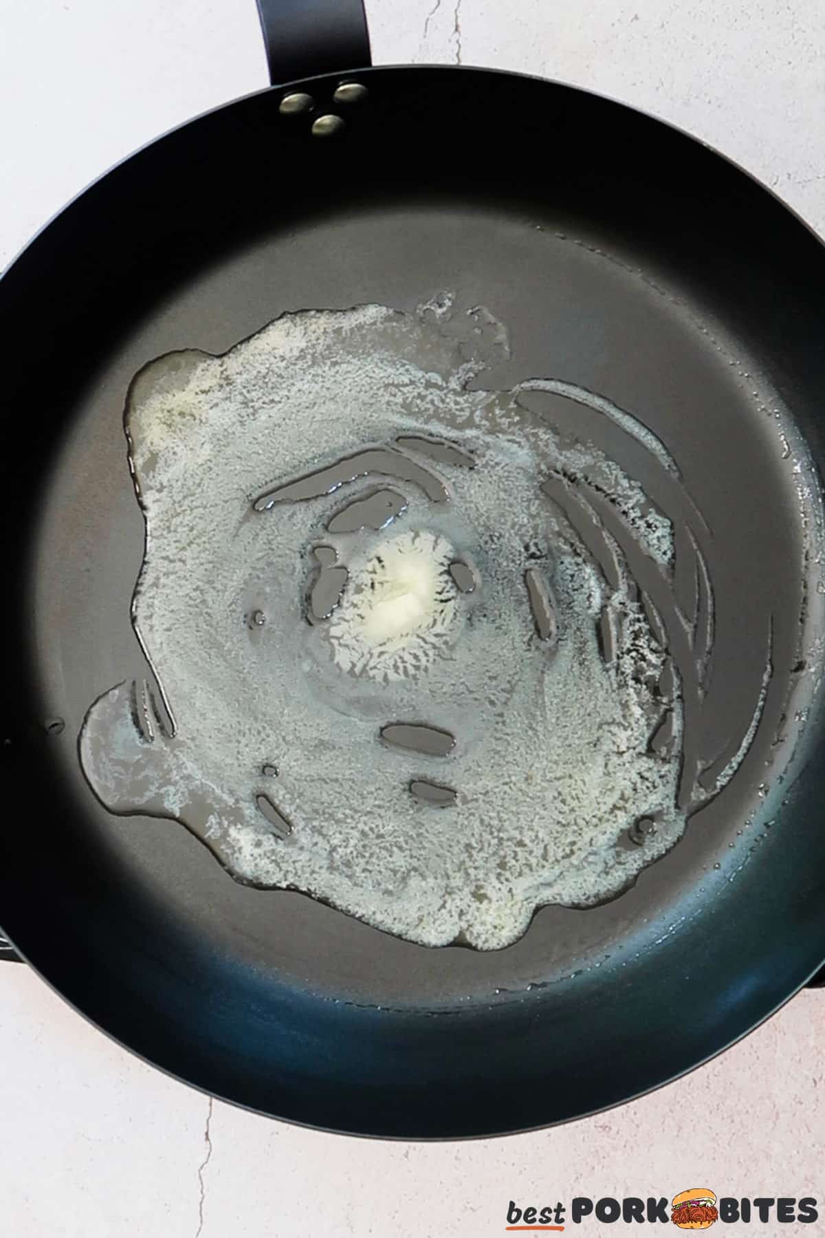 a pan with melted butter