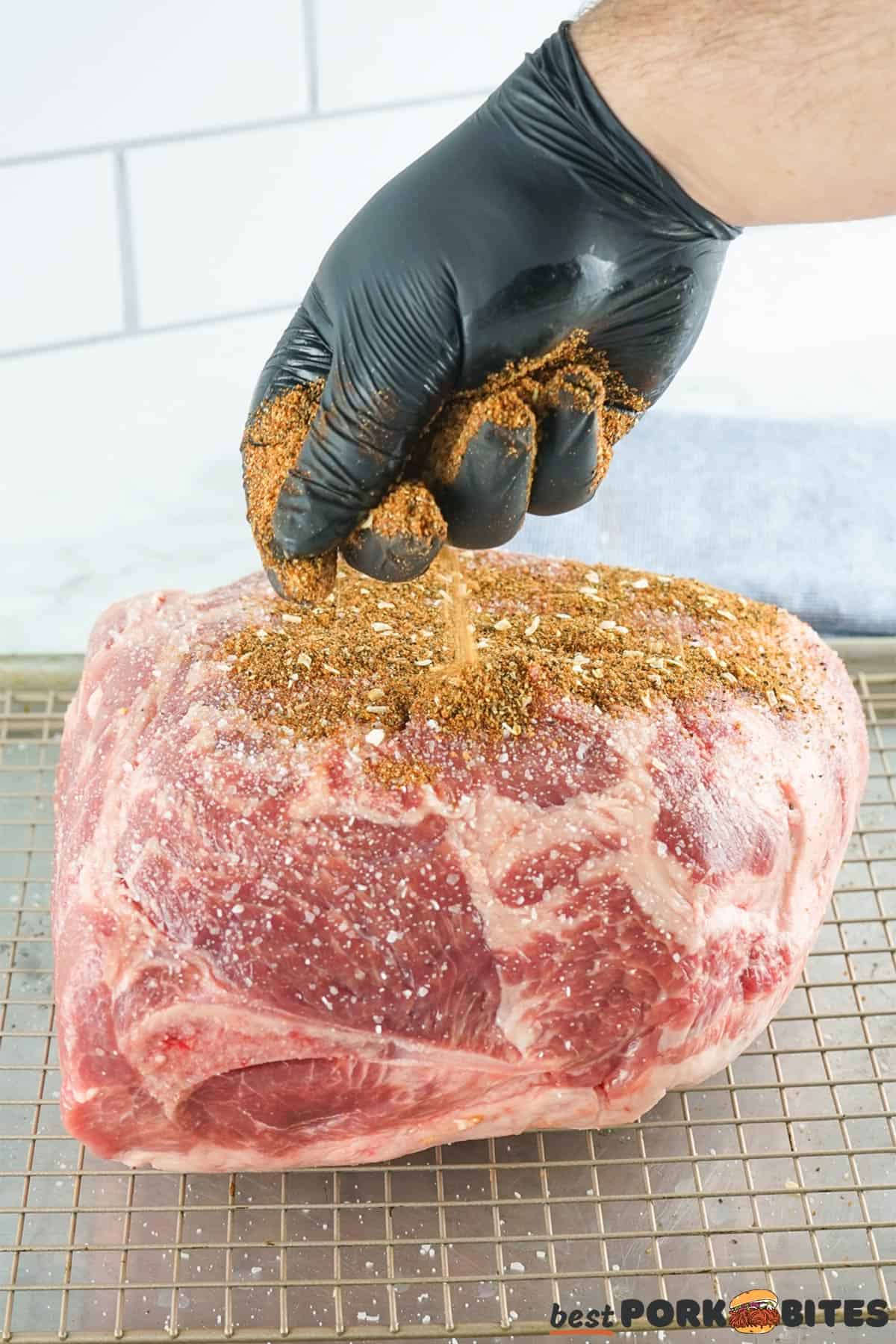 adding pork rub to pork