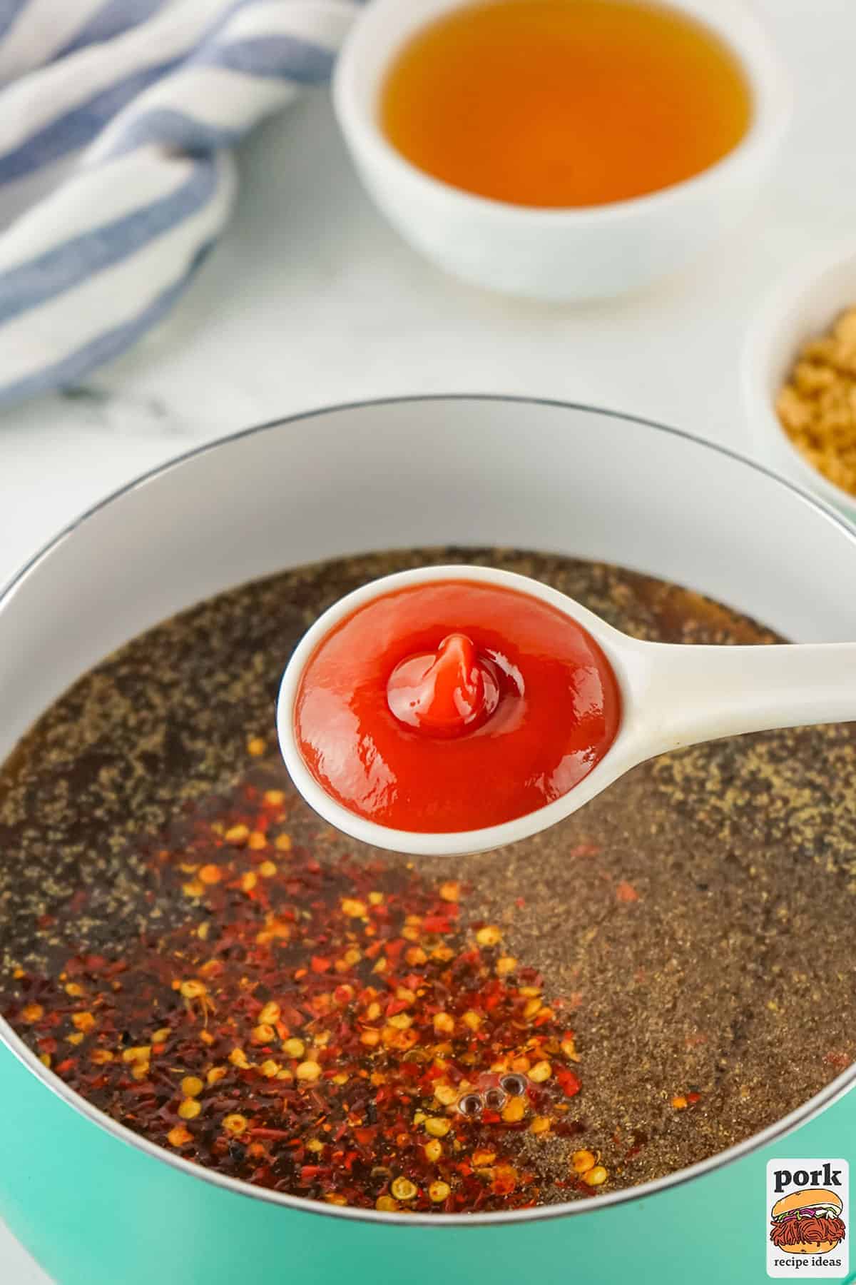 ketchup and other ingredients added to the pan