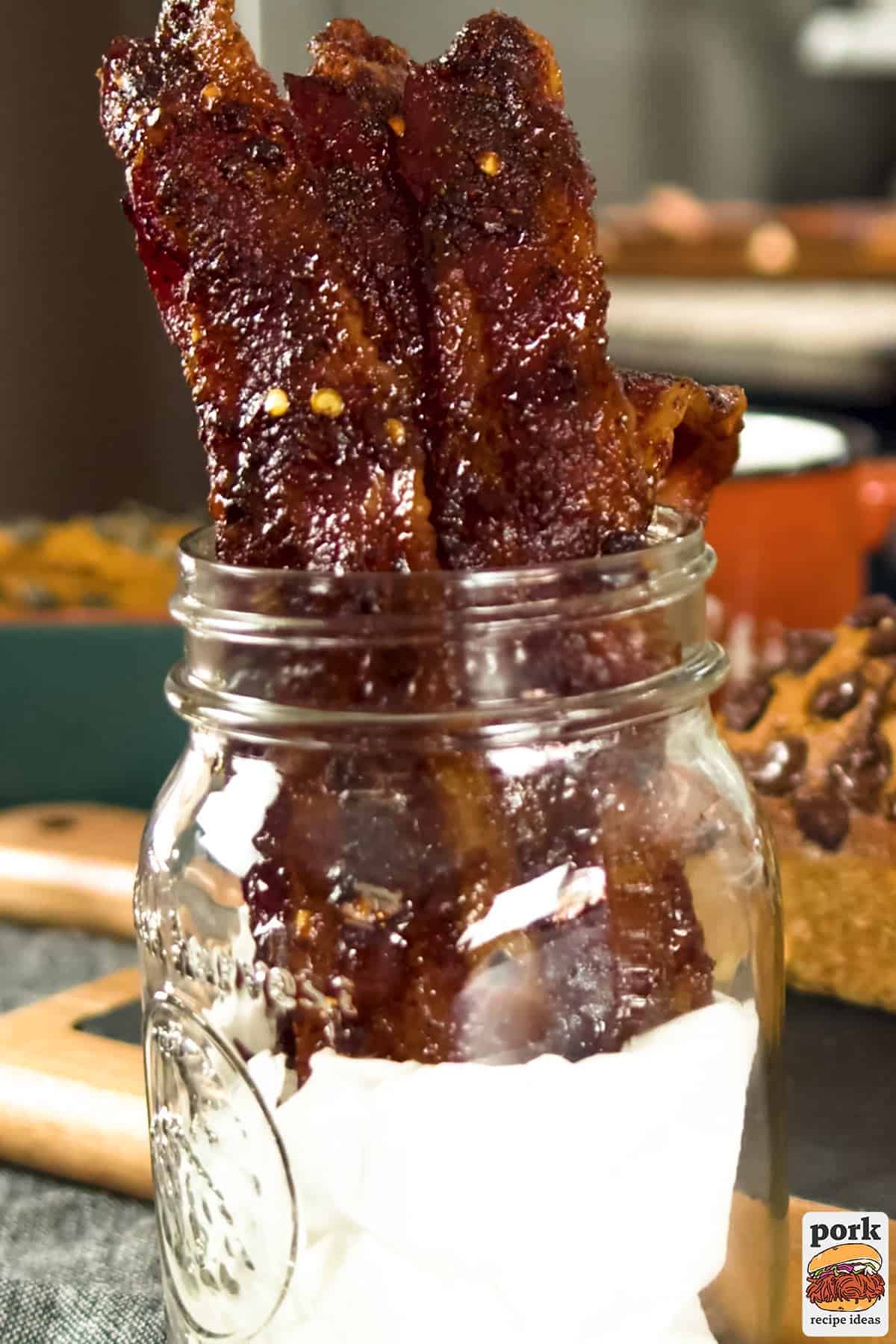 a mason jar with million dollar bacon coming out the top