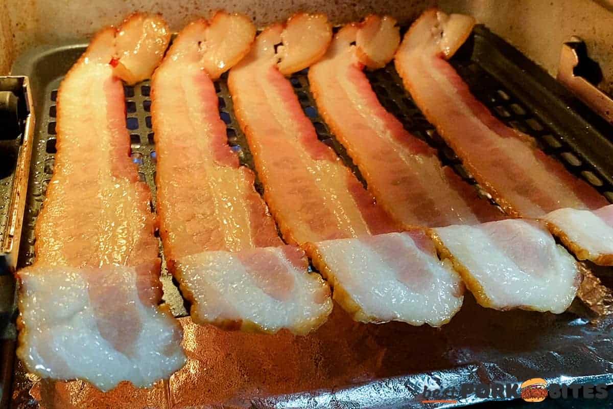 air fried bacon cooking in the air fryer