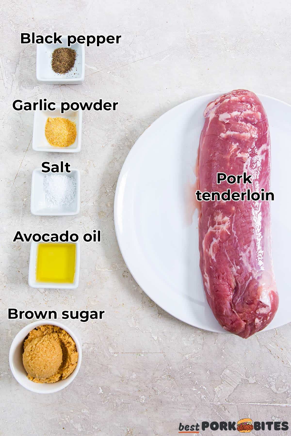 all the ingredients for air fryer pork tenderloin with labels in separate dishes